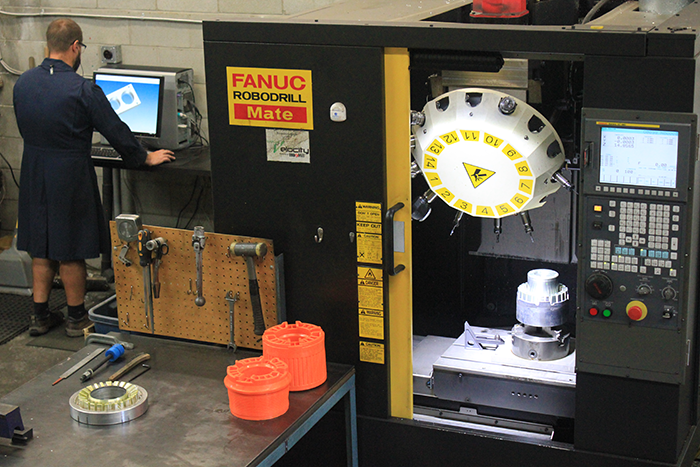 Senior tool-maker designing a new mold in our machine shop